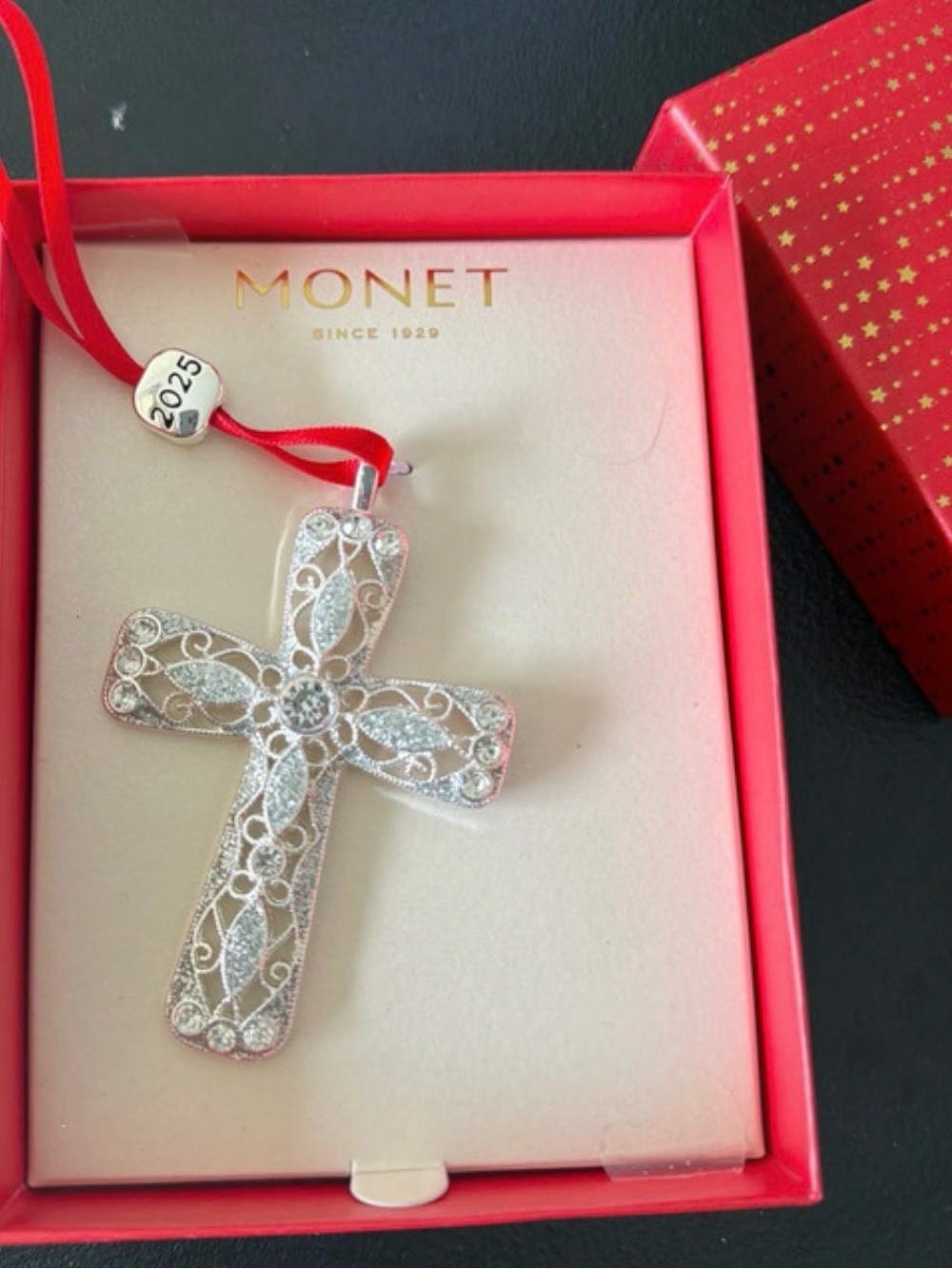 Monet Silver Filigree Cross Ornament with Red Ribbon.